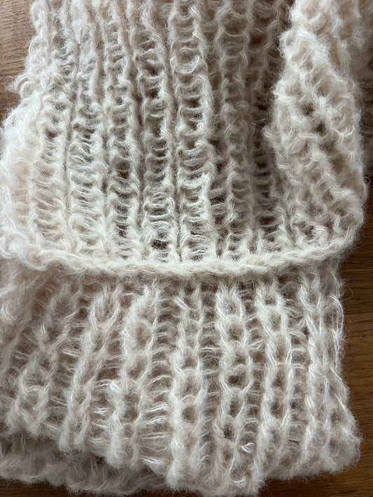 Detailed view of alpaca silk cardigan fabric, airy and slightly sheer half fisherman rib with soft halo and elegant drape
