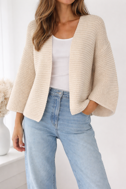 
Woman wearing the Easy Everyday Cardigan, a relaxed knit cardigan pattern with video tutorial and modern everyday styling.